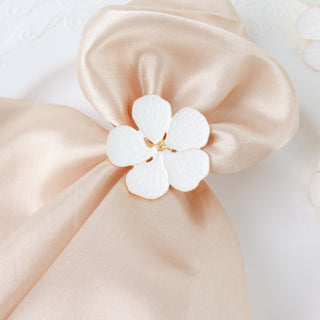 Add Style and Sparkle to Your Table with White and Gold Metal Flower Napkin Rings