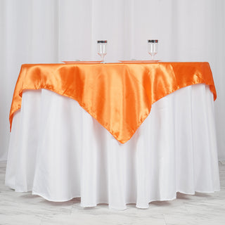 Elevate Your Event Decor with the Orange Square Smooth Satin Table Overlay