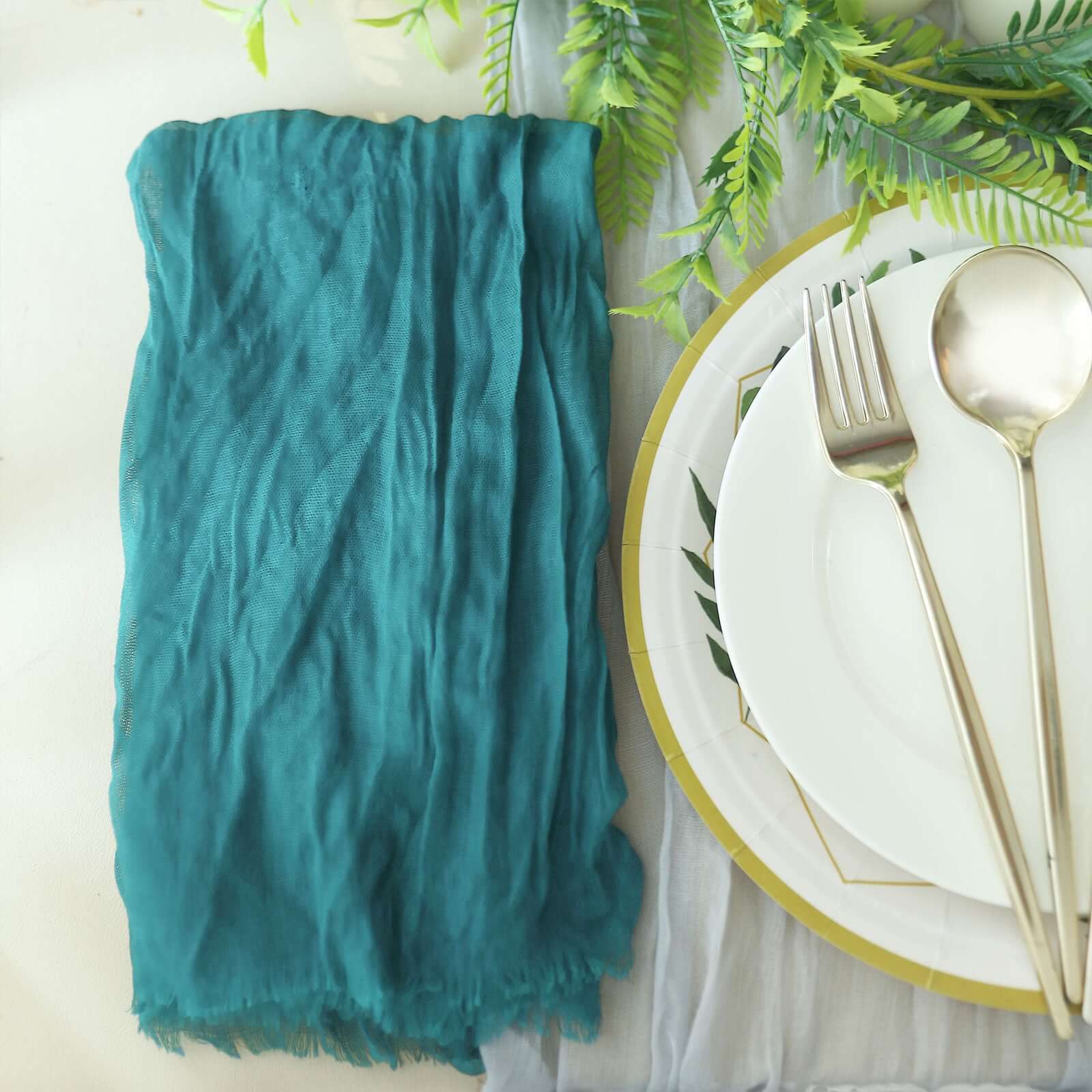 https://tableclothsfactory.com/cdn/shop/products/Peacock-Teal-Gauze-Cheesecloth-Boho-Dinner-Napkins.jpg?v=1689408121