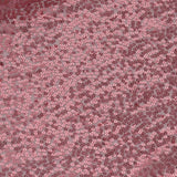 Pink sequined fabric texture with shimmering circular details.