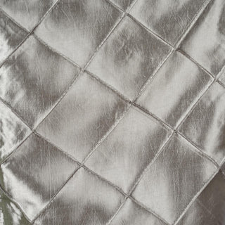 Silver quilted fabric texture with a shiny finish.