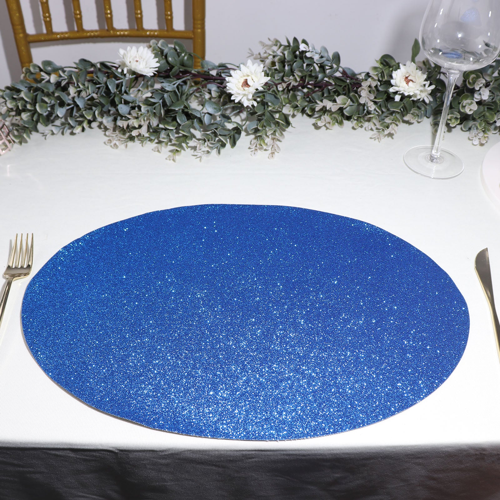 https://tableclothsfactory.com/cdn/shop/products/Royal-Blue-Oval-Sparkle-Placemats.jpg?v=1689407860