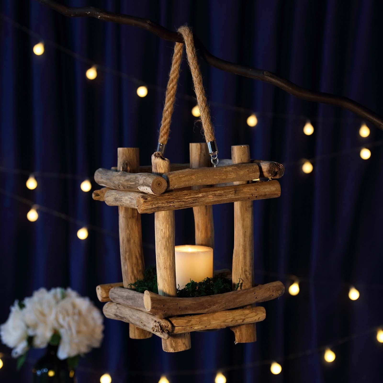 https://tableclothsfactory.com/cdn/shop/products/Rustic-Multipurpose-Wooden-Lantern-Centerpiece-Hanging-Candle-Holder-With-Rope-Handles.jpg?v=1689407485