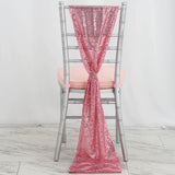 Pink sequin chair sash draped elegantly over a silver chair