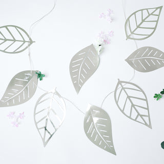 Add Shimmer and Elegance to Your Events with the 7ft Silver Foiled Paper Assorted Leaves Hanging Garland Banner