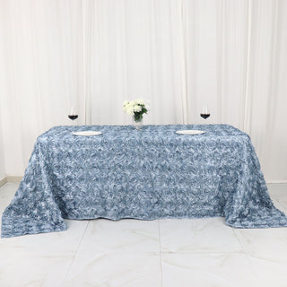 Elevate Your Event Decor with the Dusty Blue 90x132 Seamless Grandiose 3D Rosette Satin Rectangle Tablecloth