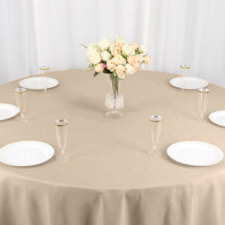 Create a Chic and Sophisticated Ambiance with the 108" Nude Seamless Polyester Round Tablecloth