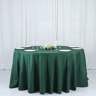 Elevate Your Event Decor with the 132" Hunter Emerald Green Seamless Polyester Round Tablecloth