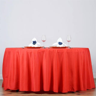 Add Elegance to Your Event with the 132" Red Seamless Polyester Round Tablecloth