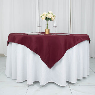 Add Elegance to Your Event with the Burgundy Seamless Premium Polyester Square Table Overlay