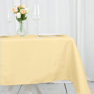 Elevate Your Table Setting with the Champagne Seamless Premium Polyester Square Table Overlay