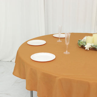 Enhance Your Event Decor with the 70" Round Gold Seamless Polyester Linen Tablecloth