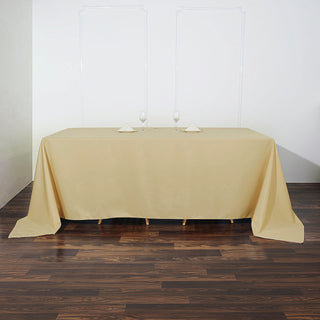 Elevate Your Event with the 90"x132" Champagne Seamless Polyester Rectangular Tablecloth
