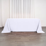 90"x132" White Polyester Rectangular Tablecloth