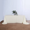 90 Inch x 156 Inch | Ivory Polyester Rounded Corner Rectangular Tablecloth | TableclothsFactory