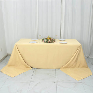 Elevate Your Event with the 90"x156" Champagne Seamless Premium Polyester Rectangular Tablecloth