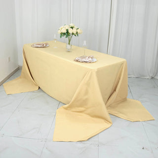 Experience Unparalleled Elegance with the 90"x156" Champagne Seamless Premium Polyester Rectangular Tablecloth