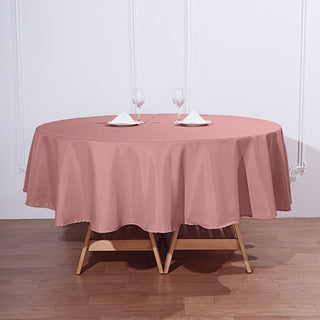 Add Elegance to Your Event with the 90" Dusty Rose Seamless Polyester Round Tablecloth