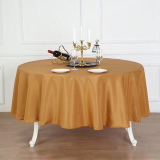 Add Elegance to Your Event with the 90" Gold Seamless Polyester Round Tablecloth