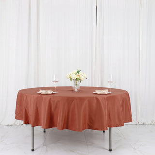Elevate Your Event with the Terracotta (Rust)  90" Seamless Polyester Round Tablecloth