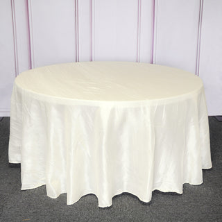 Elevate Your Event with the Ivory Seamless Accordion Crinkle Taffeta Round Tablecloth