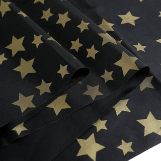 Create a Stellar Atmosphere with the Black Gold Stars Tablecloth