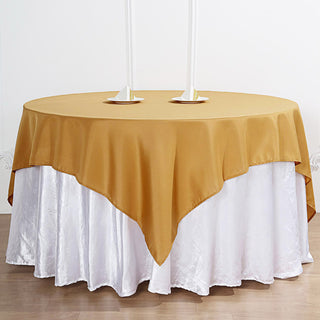 Add Elegance to Your Event with the 70"x70" Gold Square Seamless Polyester Table Overlay