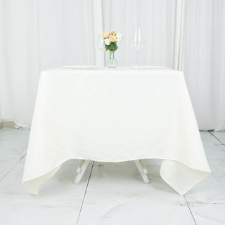 Elevate Your Event with the Ivory Premium Seamless Polyester Square Tablecloth