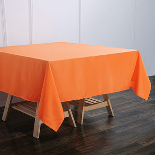 Add a Pop of Color to Your Event with the 70"x70" Orange Square Seamless Polyester Tablecloth