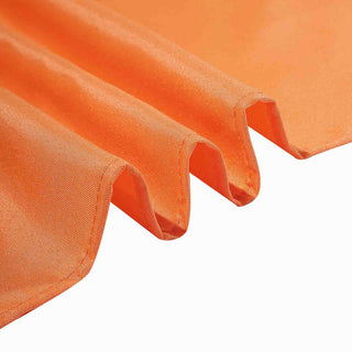 Create a Stunning Orange Table Decor with the 70"x70" Orange Square Seamless Polyester Tablecloth