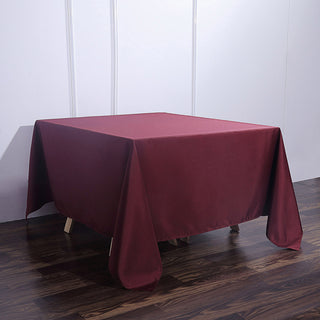 Create a Luxurious Atmosphere with the Burgundy Seamless Square Polyester Tablecloth