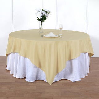 Add Elegance to Your Event with the 90"x90" Champagne Seamless Square Polyester Table Overlay
