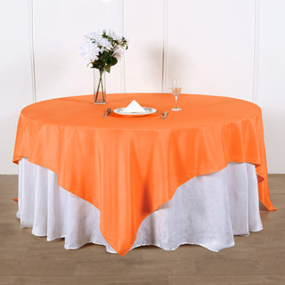 Add Elegance to Your Event with the 90x90 Orange Seamless Square Polyester Table Overlay