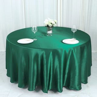 Enhance Your Event Decor with the 108" Hunter Emerald Green Seamless Satin Round Tablecloth