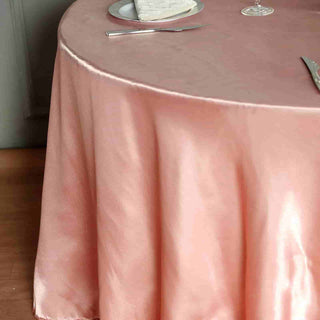 Elevate Your Event with the Dusty Rose Seamless Satin Round Tablecloth