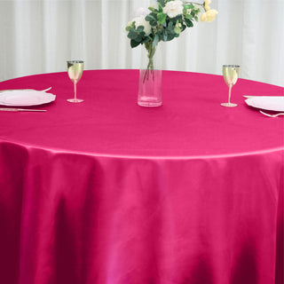 Enhance Your Event Decor with the 120" Fuchsia Seamless Satin Round Tablecloth
