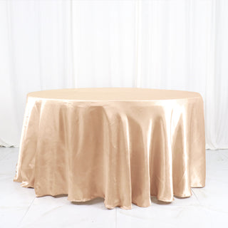 Elevate Your Event with the 120" Nude Seamless Satin Round Tablecloth