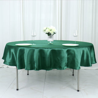 Add Elegance to Your Event with the Hunter Emerald Green Seamless Satin Round Tablecloth