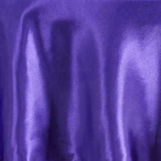 Create a Regal Atmosphere with the 90" Purple Seamless Satin Round Tablecloth