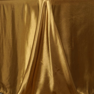 Transform Your Event with the 90"x156" Gold Seamless Satin Rectangular Tablecloth