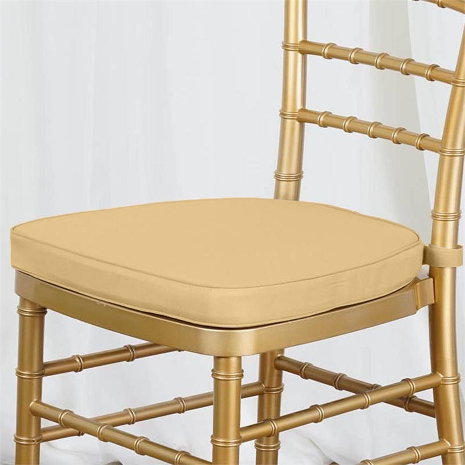 https://tableclothsfactory.com/cdn/shop/products/Thick-Champagne-Chiavari-Chair-Pad.jpg?v=1689407230