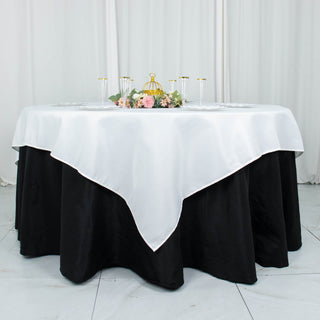 Elevate Your Event with the 70"x70" White Premium Seamless Polyester Square Table Overlay