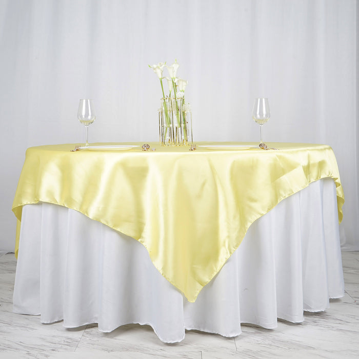 72 Inch x 72 Inch | Yellow Seamless Satin Square Tablecloth Overlay | TableclothsFactory